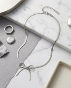 Sleek Metallic Statement Bow Choker